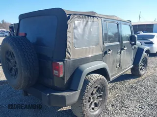 2016 Jeep Wrangler Unlimited Sport with VIN 1C4BJWDG0GL123581, listed as a IAAI auction lot 41426577 with 102,301 mi miles and . Bid and sale history available at DreamBid. Image 4.