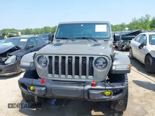 2021 Jeep Gladiator Rubicon with VIN 1C6JJTBG2ML515932, listed as a IAAI auction lot 42471704 with 57,775 mi miles and . Bid and sale history available at DreamBid. Image 13.