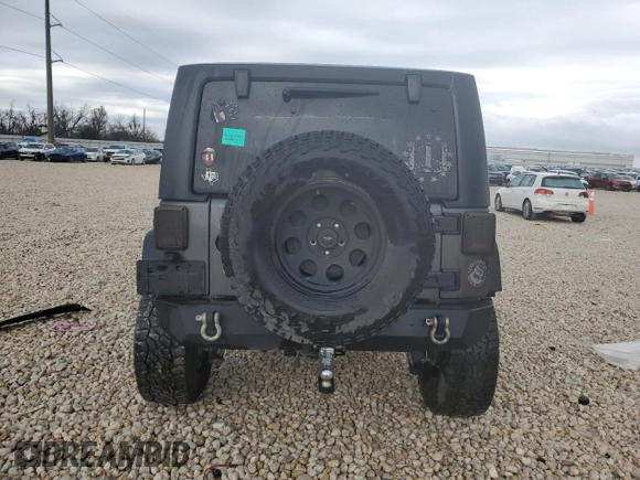 2017 Jeep Wrangler Willys Wheeler with VIN 1C4AJWAG9HL673766, listed as a Copart auction lot 43132555 with 129,422 mi miles and Salvage Title. Bid and sale history available at DreamBid. Image 6.