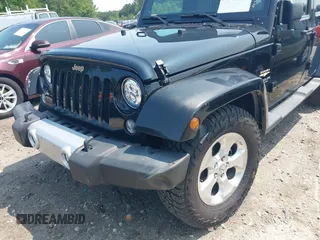 2014 Jeep Wrangler Unlimited Sahara with VIN 1C4BJWEG0EL273086, listed as a IAAI auction lot 42340938 with 121,448 mi miles and . Bid and sale history available at DreamBid. Image 6.