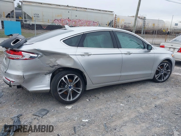 2019 Ford Fusion Titanium with VIN 3FA6P0K96KR120749, listed as a IAAI auction lot 40737085 with 118,376 mi miles and . Bid and sale history available at DreamBid. Image 13.