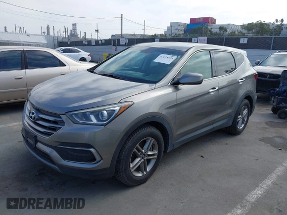 2018 Hyundai Santa Fe 2.4L with VIN 5NMZT3LB4JH069868, listed as a IAAI auction lot 42675555 with 142,612 mi miles and . Bid and sale history available at DreamBid. Image 2.