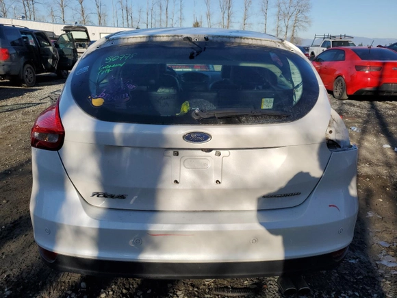 2015 Ford Focus Titanium with VIN 1FADP3N25FL325037, listed as a Copart auction lot 42248985 with 58,831 mi miles and Salvage Title. Bid and sale history available at carsss.com. Image 6.