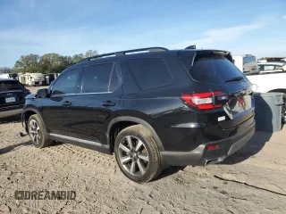 2023 Honda Pilot Touring with VIN 5FNYG2H77PB006594, listed as a Copart auction lot 83662854 with 37,637 mi miles and Salvage Title. Bid and sale history available at DreamBid. Image 2.