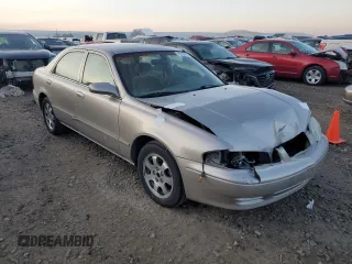 2002 Mazda 626 LX with VIN 1YVGF22C525277646, listed as a Copart auction lot 83109424 with 202,380 mi miles and Salvage Title. Bid and sale history available at carsss.com. Image 4.