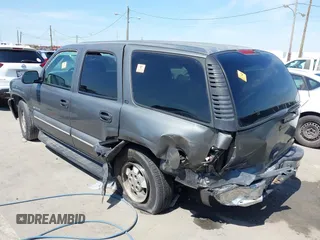 2002 Chevrolet Tahoe LS z VIN 1GNEC13V92R305304, wystawiony jako IAAI lot #41851210 z przebiegiem Nie podano mil oraz . Historia ofert i sprzedaży dostępna na DreamBid. Obrazek 3.