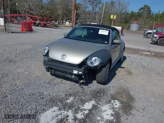 2013 Volkswagen Beetle Convertible 2.5L with VIN 3VW5X7AT9DM816045, listed as a IAAI auction lot 41488594 with 51,572 mi miles. Bid and sale history available at carsss.com. Image 18.