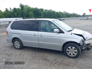 2004 Honda Odyssey EX-L z VIN 5FNRL189X4B013837, wystawiony jako IAAI lot #42215471 z przebiegiem 208 729 mil mil oraz . Historia ofert i sprzedaży dostępna na DreamBid. Obrazek 14.