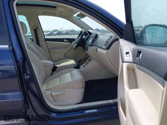2012 Volkswagen Tiguan SEL with VIN WVGAV7AX8CW536752, listed as a IAAI auction lot 41798619 with 128,223 mi miles and . Bid and sale history available at DreamBid. Image 5.
