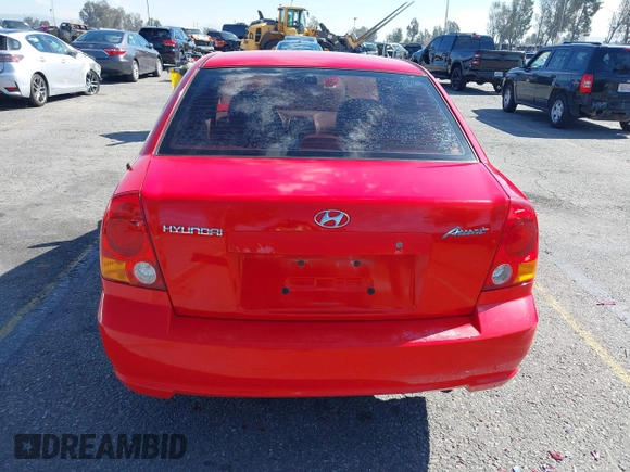 2003 Hyundai Accent GL with VIN KMHCG45C93U487209, listed as a IAAI auction lot 41590636 with 118,811 mi miles. Bid and sale history available at carsss.com. Image 16.