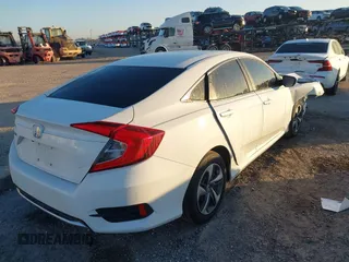 2019 Honda Civic LX with VIN 19XFC2F61KE014007, listed as a IAAI auction lot 41795070 with 64,259 mi miles and . Bid and sale history available at DreamBid. Image 4.