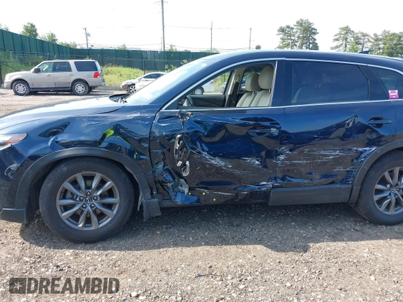 2021 Mazda CX-9 Touring with VIN JM3TCBCY7M0507699, listed as a IAAI auction lot 42603614 with 62,635 mi miles and . Bid and sale history available at DreamBid. Image 6.