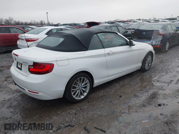 2016 BMW 2 Series 228i xDrive with VIN WBA1L9C59GV767802, listed as a IAAI auction lot 41132997 with 87,674 mi miles. Bid and sale history available at carsss.com. Image 4.