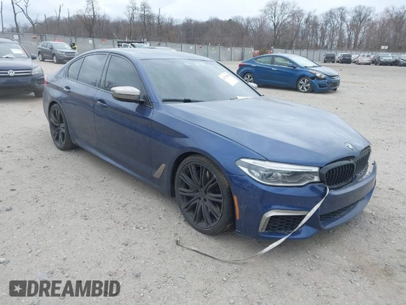 2018 BMW 5 Series M550i xDrive with VIN WBAJB9C56JG463891, listed as a IAAI auction lot 41731556 with 104,860 mi miles. Bid and sale history available at carsss.com. Image 1.