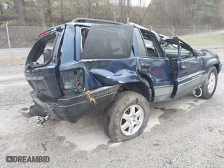 2002 Jeep Grand Cherokee Laredo with VIN 1J4GW48S82C321712, listed as a IAAI auction lot 41855809 with 1 mi miles. Bid and sale history available at carsss.com. Image 4.