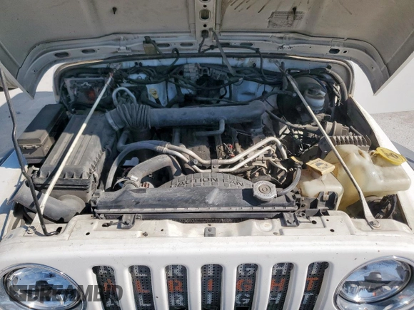 2004 Jeep Wrangler Rubicon z VIN 1J4FA69S34P757352, wystawiony jako Copart lot #52971745 z przebiegiem 139 855 mil mil oraz Szkoda całkowita • Salvage title. Historia ofert i sprzedaży dostępna na DreamBid. Obrazek 12.