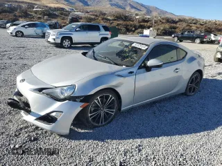2014 Scion FR-S with VIN JF1ZNAA16E8708791, listed as a Copart auction lot 82329124 with 77,756 mi miles and Salvage Title. Bid and sale history available at DreamBid. Image 1.