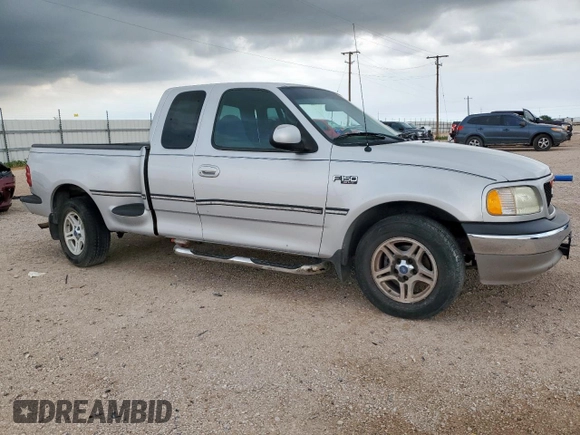 1999 Ford F-150 with VIN 1FTRX07W0XKB88434, listed as a Copart auction lot 60063135 with 277,188 mi miles and Salvage title. Bid and sale history available at DreamBid. Image 4.