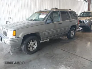 1998 Jeep Grand Cherokee Laredo with VIN 1J4GZ48S4WC262249, listed as a IAAI auction lot 42739473 with 94,094 mi miles and . Bid and sale history available at DreamBid. Image 2.