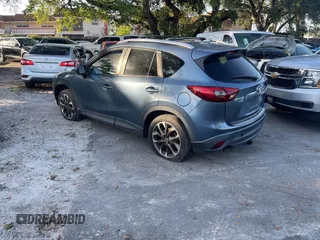 2016 Mazda CX-5 Grand Touring with VIN JM3KE4DY9G0673789, listed as a IAAI auction lot 42196841 with 98,622 mi miles and . Bid and sale history available at DreamBid. Image 3.