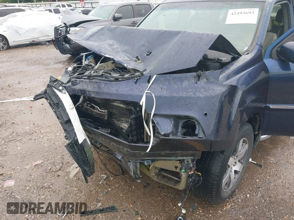 2013 Honda Pilot Touring with VIN 5FNYF4H95DB007125, listed as a IAAI auction lot 42493693 with Not provided miles and . Bid and sale history available at DreamBid. Image 6.