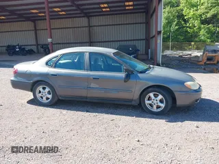 2005 Ford Taurus SE with VIN 1FAFP532X5A272398, listed as a IAAI auction lot 42001798 with 159,199 mi miles. Bid and sale history available at carsss.com. Image 6.