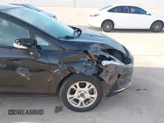 2014 Ford Fiesta SE with VIN 3FADP4BJ0EM139467, listed as a IAAI auction lot 41817437 with 45,570 mi miles and . Bid and sale history available at DreamBid. Image 6.