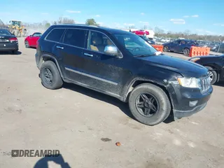 2011 Jeep Grand Cherokee Laredo with VIN 1J4RR4GG2BC585859, listed as a IAAI auction lot 41901919 with 272,585 mi miles. Bid and sale history available at carsss.com. Image 1.