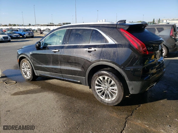 2024 Cadillac XT4 AWD Premium Luxury with VIN 1GYFZDR49RF128402, listed as a Copart auction lot 77630154 with 20,673 mi miles and Salvage Title. Bid and sale history available at carsss.com. Image 2.