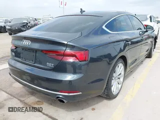 2018 Audi A5 Sportback Premium z VIN WAUANCF5XJA022221, wystawiony jako IAAI lot #42041410 z przebiegiem 94 851 mil mil oraz . Historia ofert i sprzedaży dostępna na DreamBid. Obrazek 4.