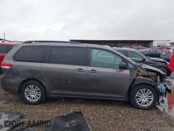 2014 Toyota Sienna XLE with VIN 5TDYK3DC0ES502482, listed as a IAAI auction lot 41910683 with 151,330 mi miles. Bid and sale history available at carsss.com. Image 14.