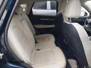 2023 Mazda CX-5 S Premium with VIN JM3KFBDM4P0185865, listed as a IAAI auction lot 42040234 with 32,761 mi miles and . Bid and sale history available at DreamBid. Image 8.