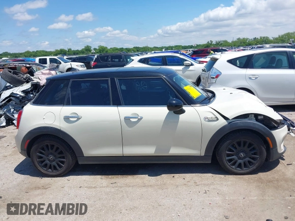 2016 MINI Hardtop 4 Door z VIN WMWXU1C50G2D08848, wystawiony jako IAAI lot #42215256 z przebiegiem 102 643 mil mil oraz . Historia ofert i sprzedaży dostępna na DreamBid. Obrazek 14.
