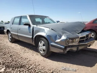 1991 Dodge Dynasty LE z VIN 1B3XC56R9MD115785, wystawiony jako Copart lot #48073715 z przebiegiem 64 483 mil mil oraz Szkoda całkowita • Salvage title. Historia ofert i sprzedaży dostępna na DreamBid. Obrazek 4.