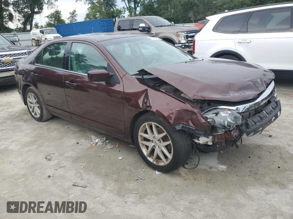 2012 Ford Fusion SEL z VIN 3FAHP0JA5CR184593, wystawiony jako Copart lot #61647265 z przebiegiem 127 720 mil mil oraz Szkoda całkowita • Salvage title. Historia ofert i sprzedaży dostępna na DreamBid. Obrazek 4.