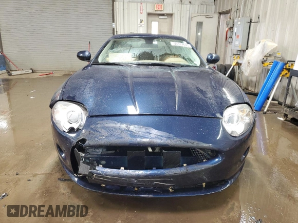2007 Jaguar XK with VIN SAJDA44BX75B00447, listed as a Copart auction lot 50147695 with 119,467 mi miles and Salvage Title. Bid and sale history available at carsss.com. Image 5.