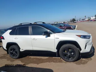 2021 Toyota RAV4 Hybrid XSE with VIN 4T3E6RFV3MU042773, listed as a IAAI auction lot 42000073 with 55,110 mi miles and . Bid and sale history available at DreamBid. Image 14.