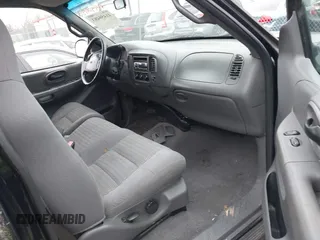 2001 Ford F-150 XL with VIN 2FTZF07211CA54107, listed as a IAAI auction lot 41450483 with 153,699 mi miles. Bid and sale history available at carsss.com. Image 5.