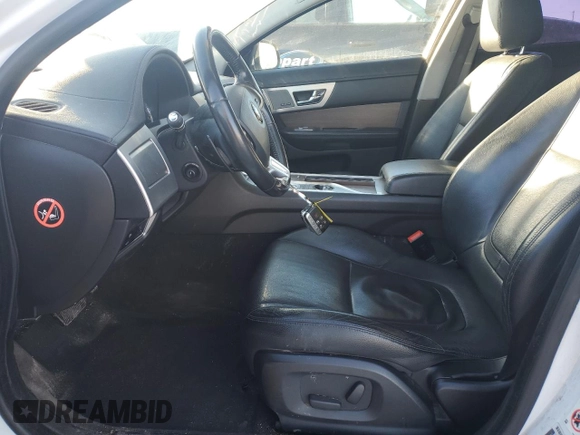 2015 Jaguar XF with VIN SAJXA0FS5FPU49437, listed as a Copart auction lot 84757254 with 99,301 mi miles and Salvage Title. Bid and sale history available at DreamBid. Image 7.