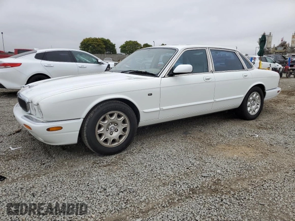1999 Jaguar XJ with VIN SAJHX1040XC864208, listed as a Copart auction lot 59748585 with 130,577 mi miles and Clean title. Bid and sale history available at DreamBid. Image 1.