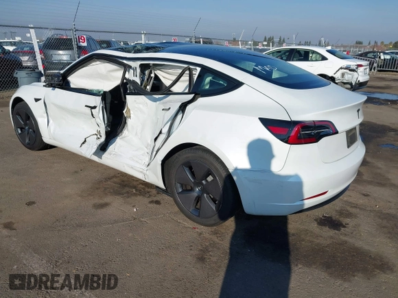 2023 Tesla Model 3 with VIN 5YJ3E1EA2PF582331, listed as a IAAI auction lot 41043858 with 33,601 mi miles and . Bid and sale history available at DreamBid. Image 3.