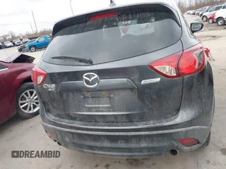 2015 Mazda CX-5 Grand Touring with VIN JM3KE4DY0F0479229, listed as a IAAI auction lot 41838381 with 139,843 mi miles. Bid and sale history available at carsss.com. Image 16.