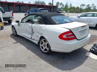 2005 Mercedes-Benz CLK 5.0L with VIN WDBTK75J55F123328, listed as a IAAI auction lot 42082590 with 58,969 mi miles. Bid and sale history available at carsss.com. Image 3.
