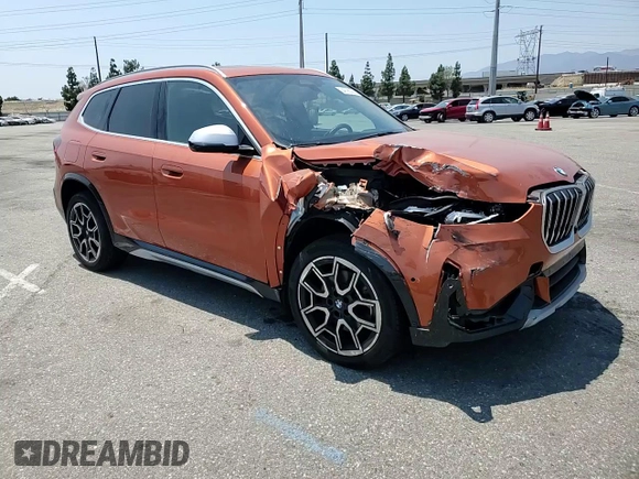 2023 BMW X1 xDrive28i with VIN WBX73EF03P5W54209, listed as a Copart auction lot 64796365 with 19,591 mi miles and Salvage title. Bid and sale history available at DreamBid. Image 14.