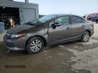 2012 Honda Civic LX z VIN 2HGFB2F55CH565610, wystawiony jako Copart lot #60072685 z przebiegiem 183 249 mil mil oraz Czysty tytuł • Clean title. Historia ofert i sprzedaży dostępna na DreamBid. Obrazek 1.