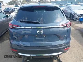 2021 Mazda CX-9 Carbon Edition z VIN JM3TCBDY0M0526352, wystawiony jako IAAI lot #42403901 z przebiegiem 50 193 mil mil oraz . Historia ofert i sprzedaży dostępna na DreamBid. Obrazek 16.