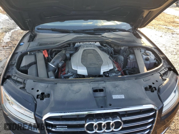 2015 Audi A8 z VIN WAUJGAFD4FN028750, wystawiony jako Copart lot #89099265 z przebiegiem 44 149 mil mil oraz Szkoda całkowita • Salvage title. Historia ofert i sprzedaży dostępna na DreamBid. Obrazek 11.