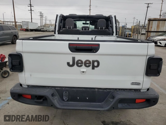 2023 Jeep Gladiator Overland z VIN 1C6HJTFG6PL516742, wystawiony jako Copart lot #65762465 z przebiegiem Nie podano mil oraz Szkoda całkowita • Salvage title. Historia ofert i sprzedaży dostępna na DreamBid. Obrazek 6.
