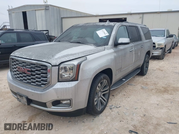 2019 GMC Yukon XL Denali with VIN 1GKS1HKJ0KR257673, listed as a IAAI auction lot 41375951 with 71,291 mi miles. Bid and sale history available at carsss.com. Image 2.