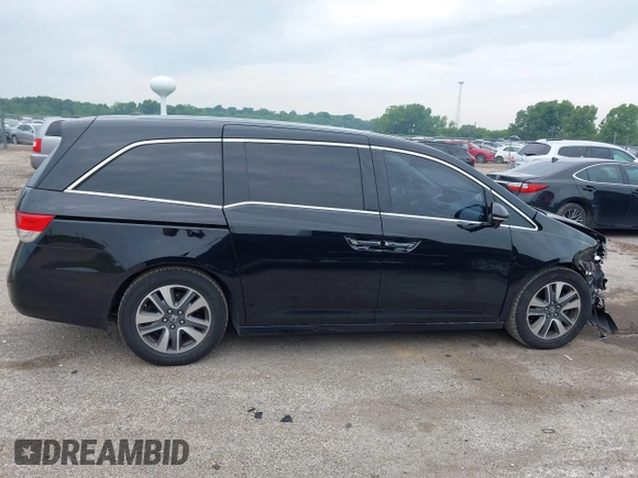2015 Honda Odyssey Touring Elite with VIN 5FNRL5H97FB124565, listed as a IAAI auction lot 42358412 with 206,444 mi miles and . Bid and sale history available at DreamBid. Image 14.